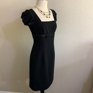 Designer black dress with puff sleeves